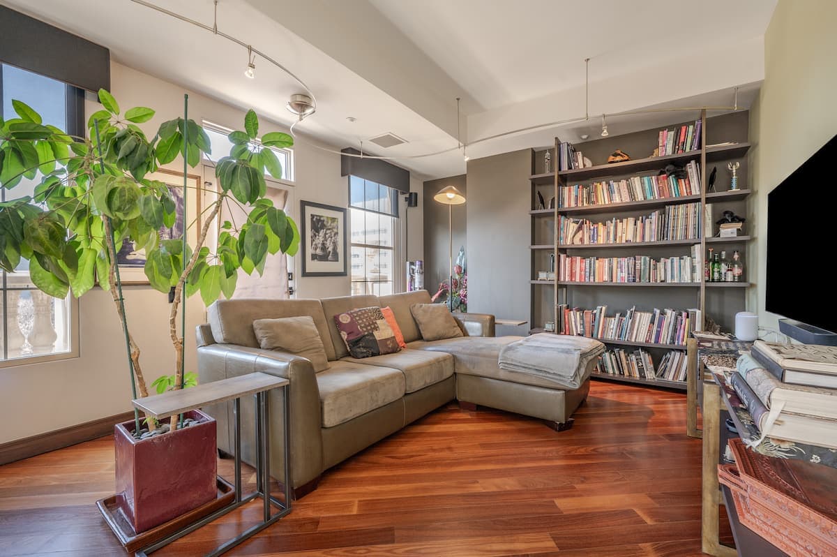 Living room with a sectional sofa and built-in bookshelves