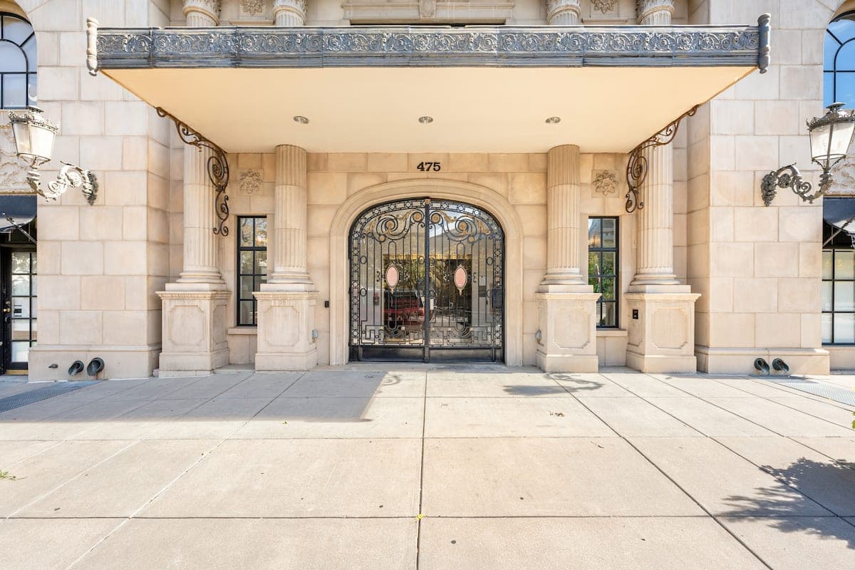 The Belvedere Tower's arched, gated entrance at 475 W 12th Avenue